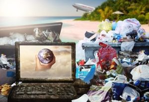 Laptop in a pile of rubbish on a beach
